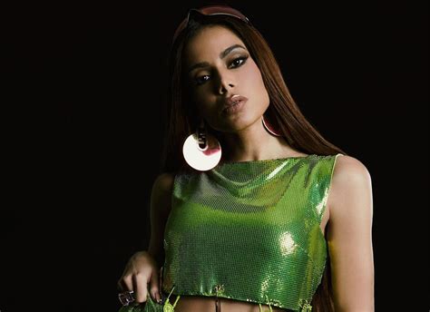 Anitta Unveils Samba-Rock Fusion at Rio Rhythms Concert: An electrifying performance showcasing Brazilian musical heritage and contemporary pop influences!